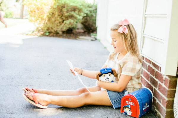 Girl reading letters from Milo